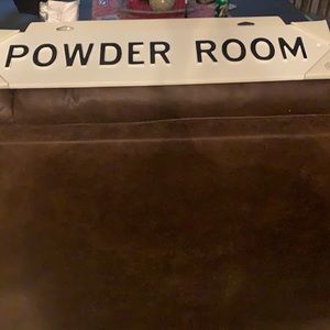 Metal powder room plack